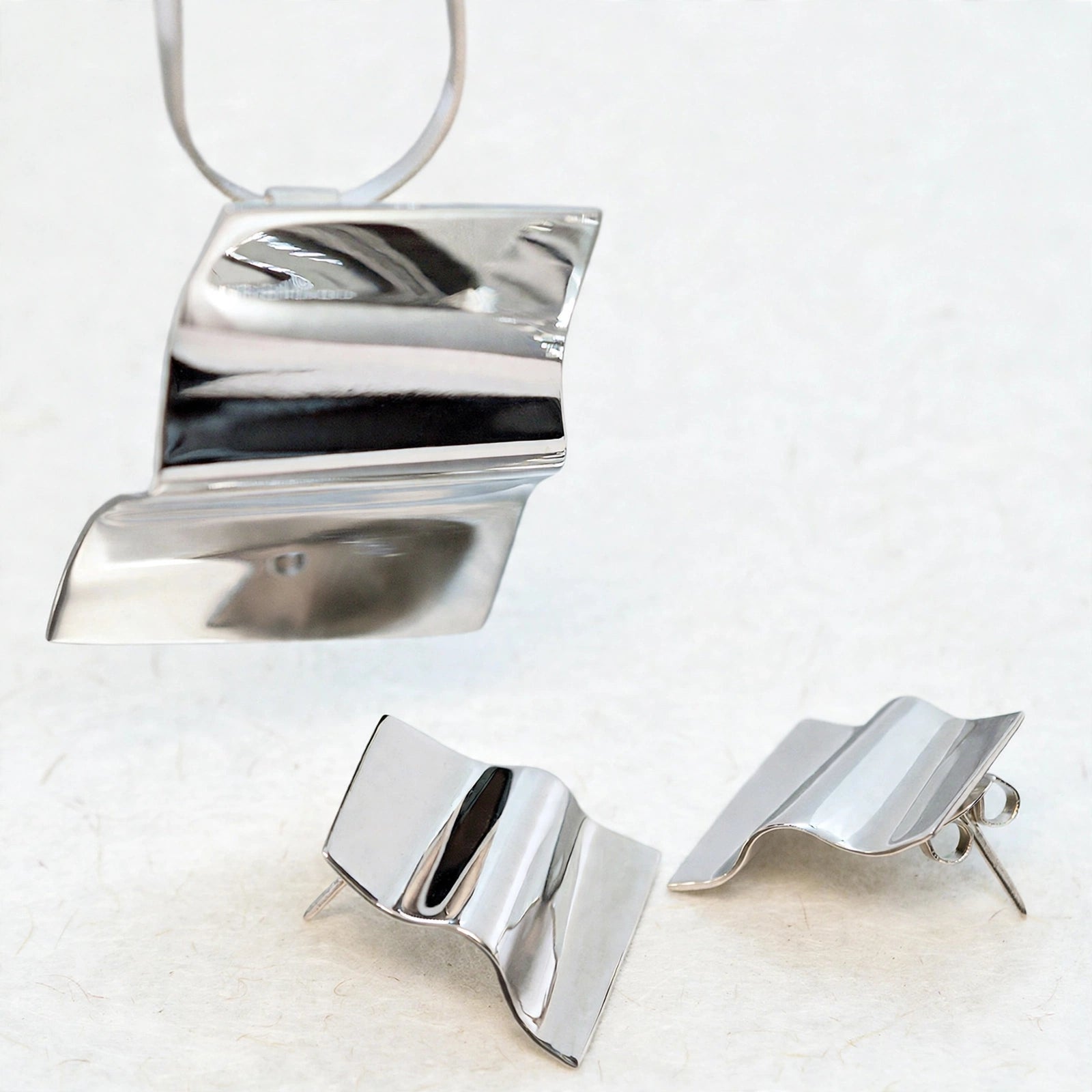 Dije y aretes de plata