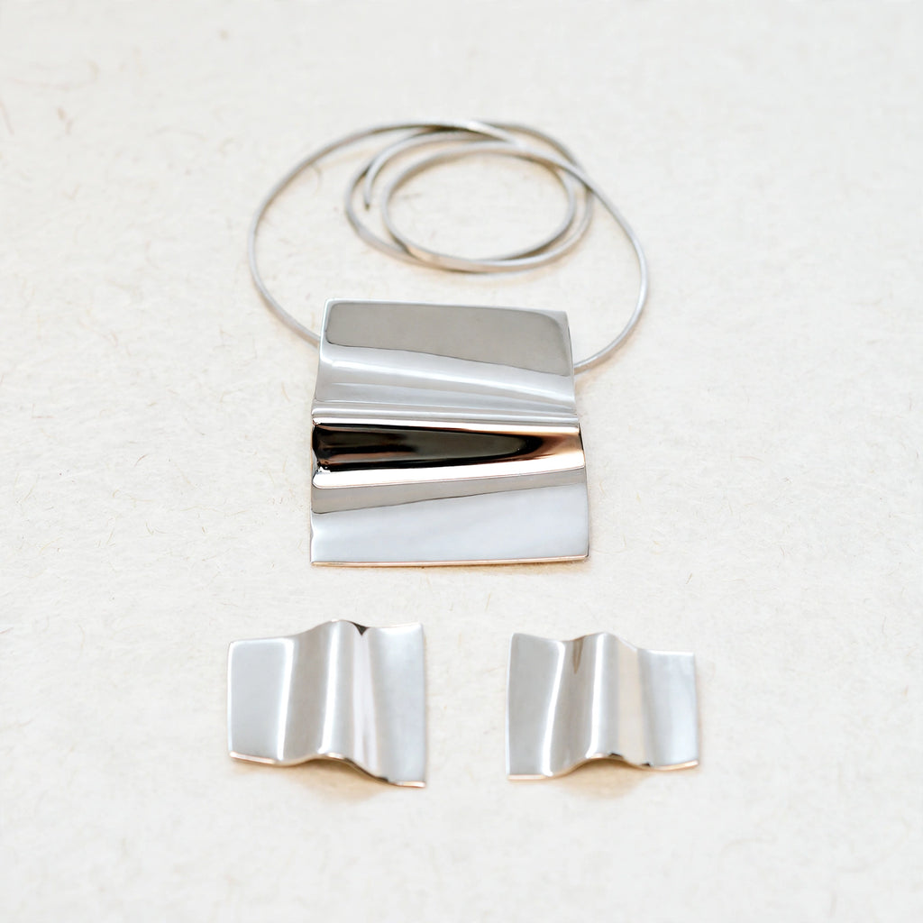 Dije y aretes de plata