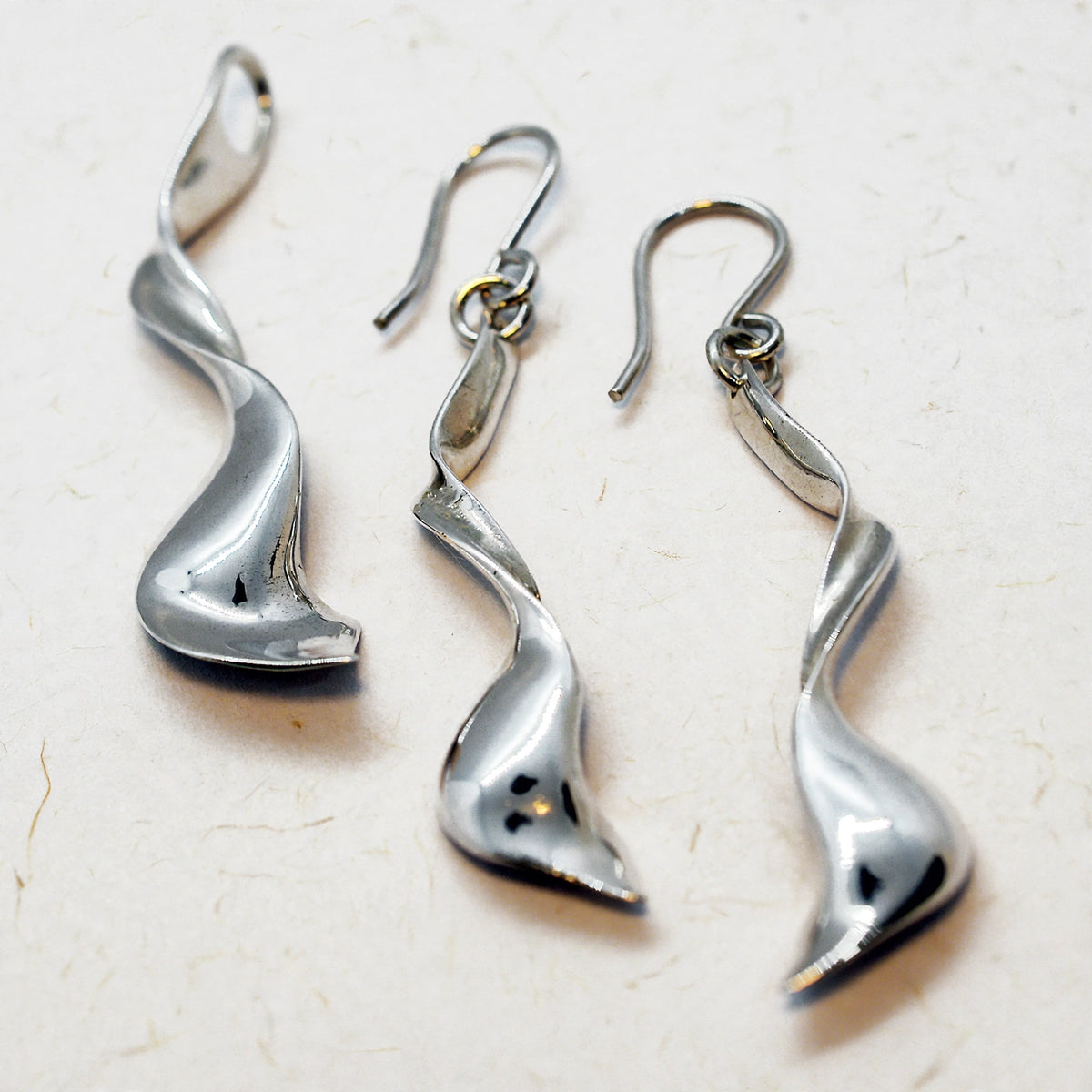 Dije y Aretes Torbellino