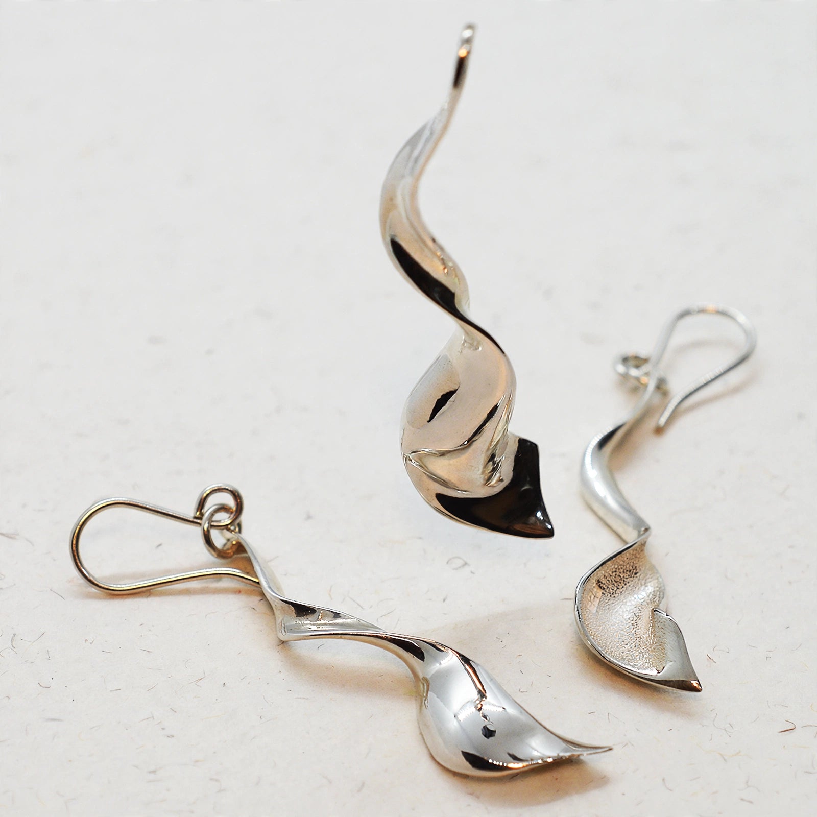 Dije y Aretes Torbellino
